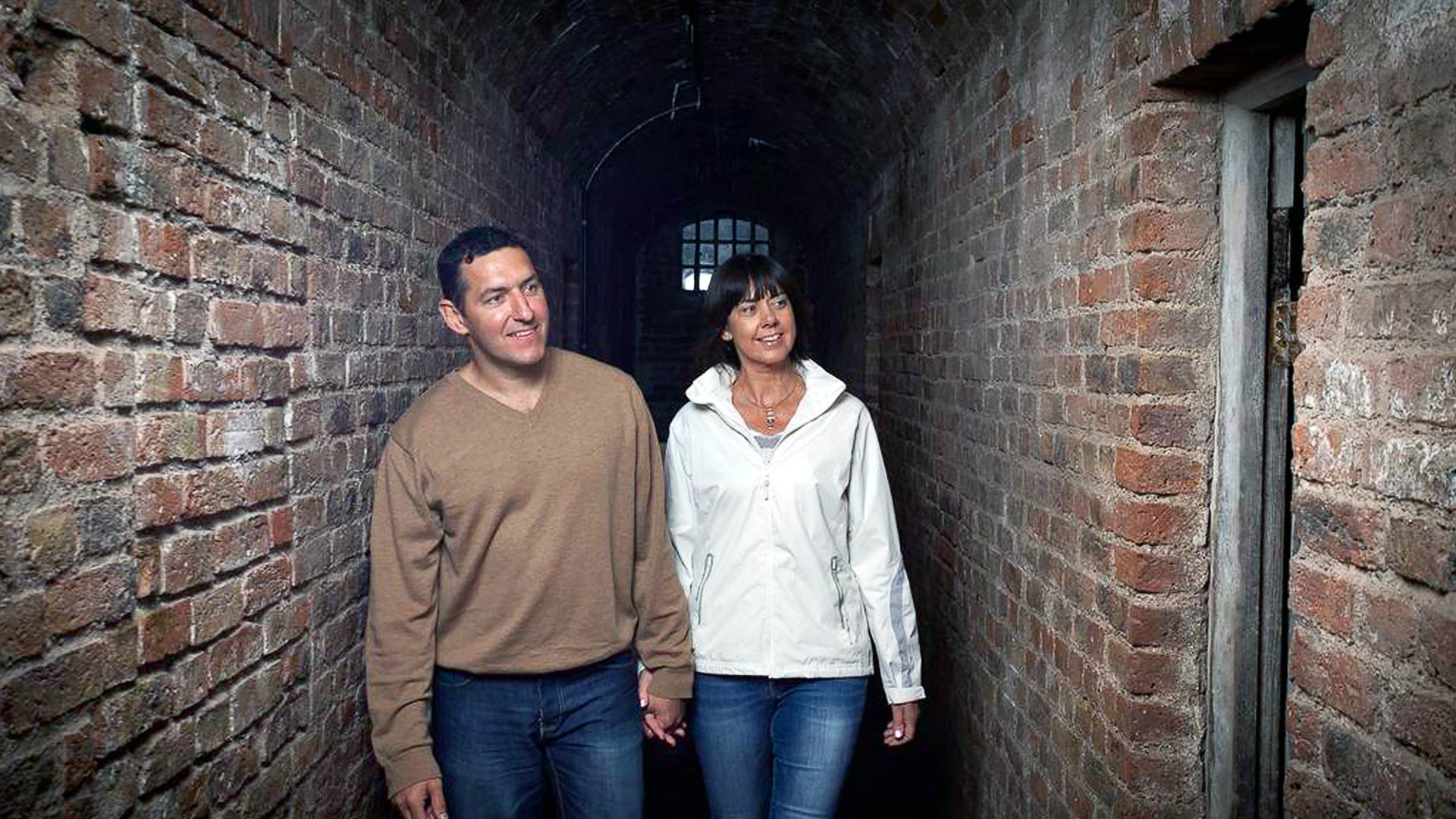 Two people explore tunnels at Spike Island, one of the top 10 things to do in Cork
