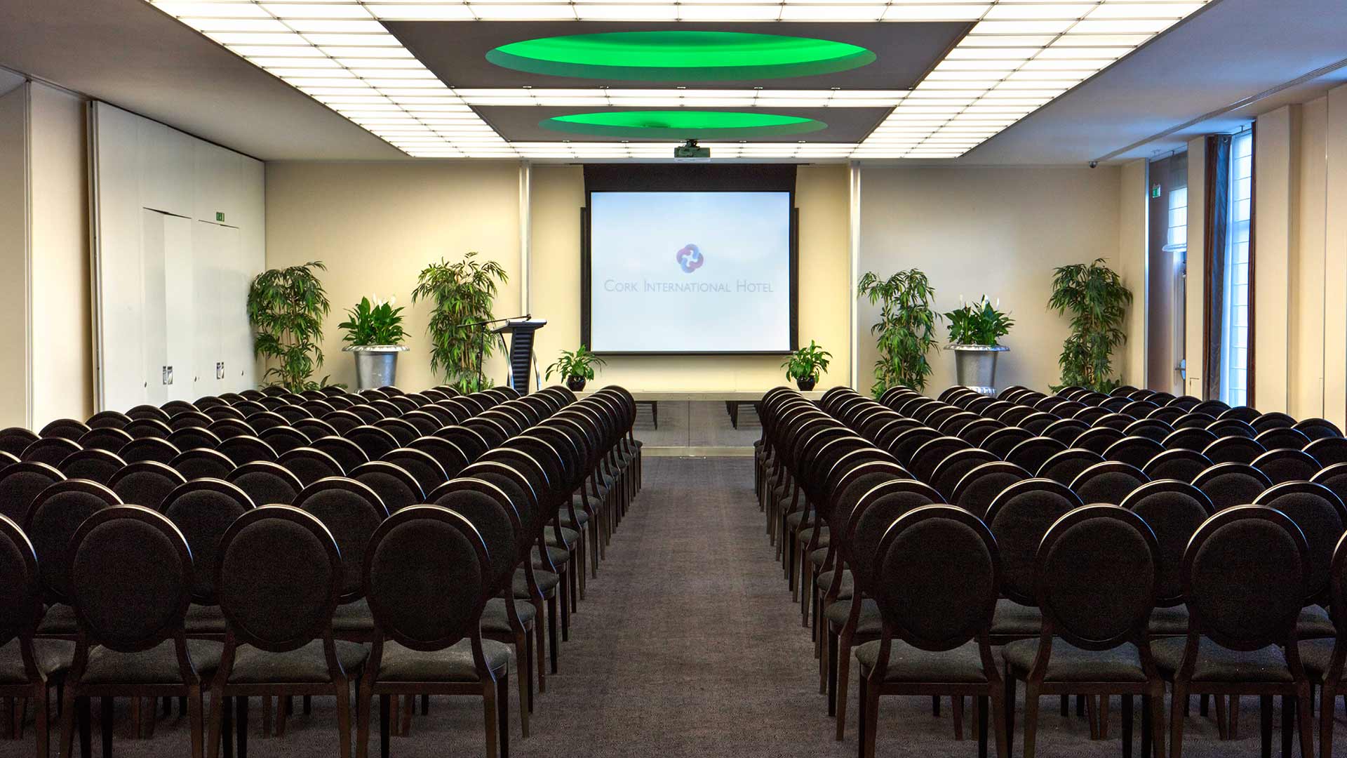 Large function room with seats arranged theatre style for a conference at Cork International Hotel