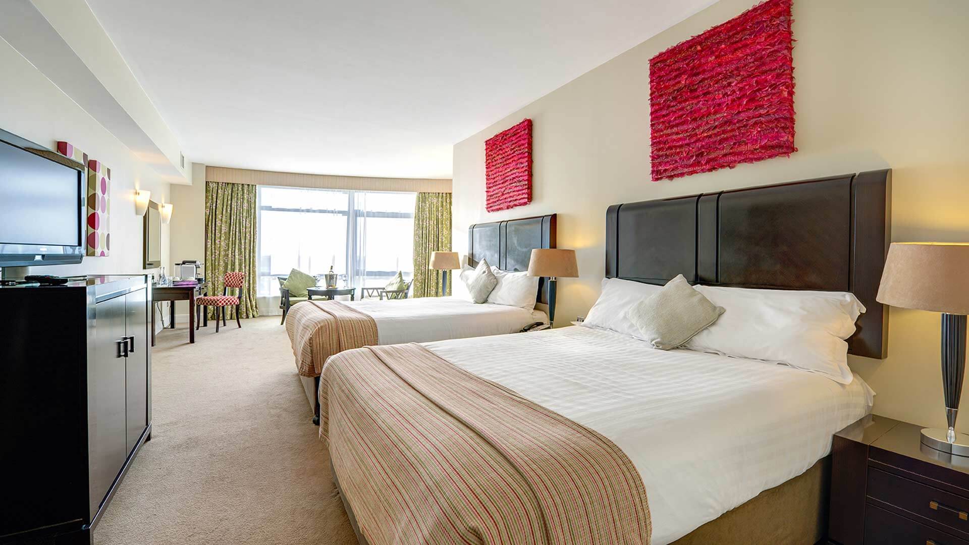 Two comfy king size beds in a family executive room at Cork International Hotel