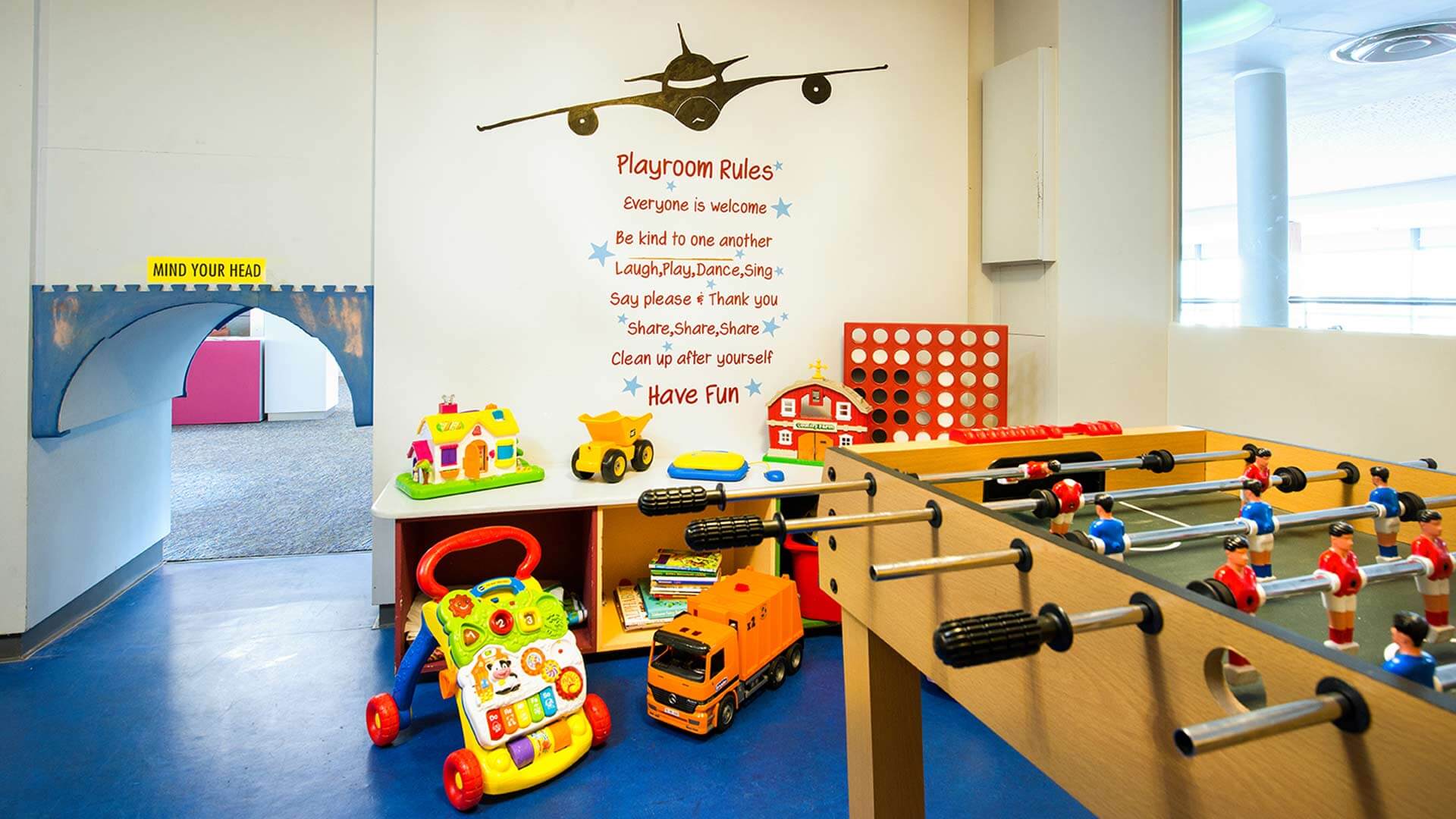 Childrens playroom including toys and foosball table at Cork International Hotel