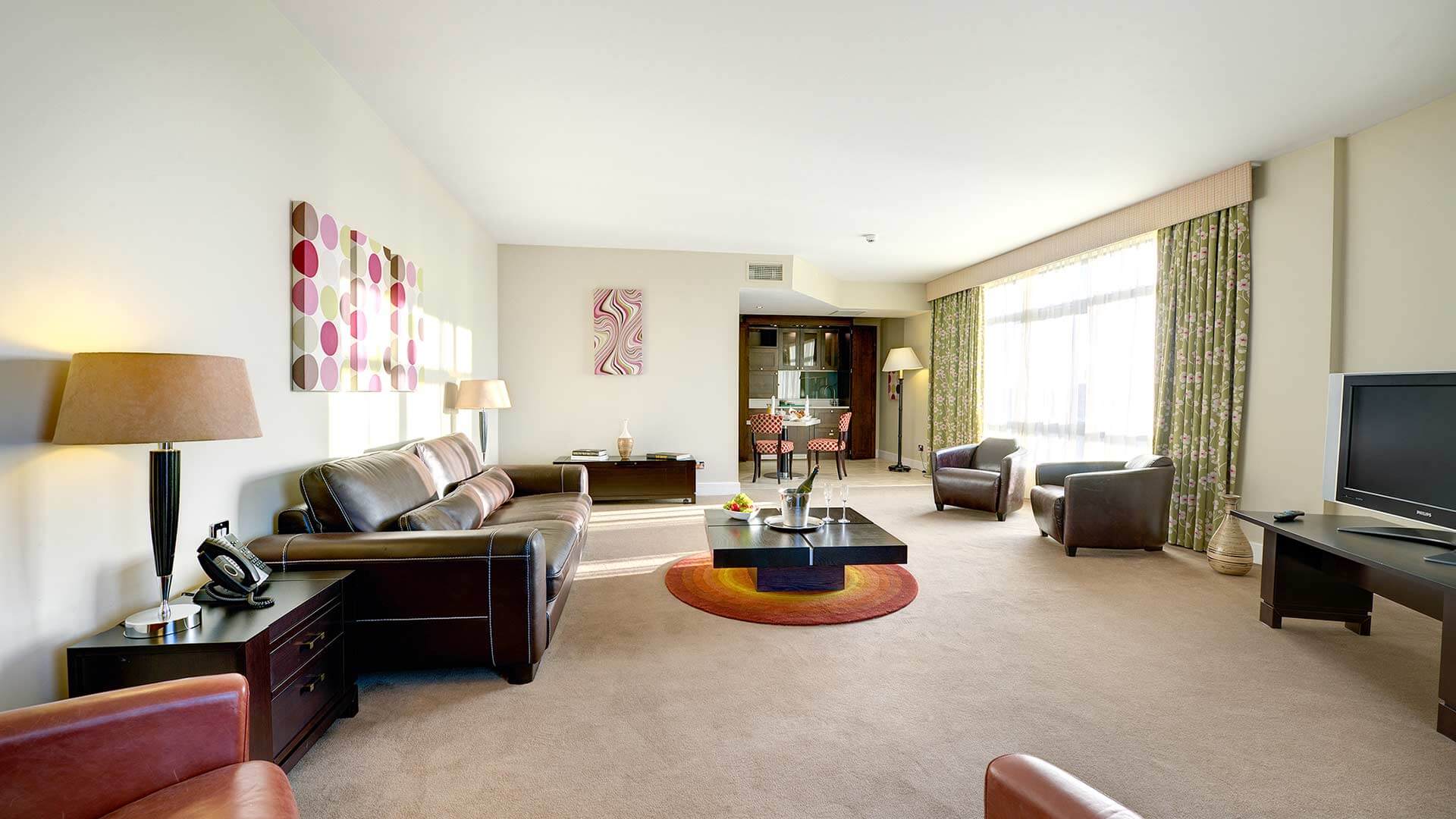 Spacious suite with a large seated area at the Cork International Hotel